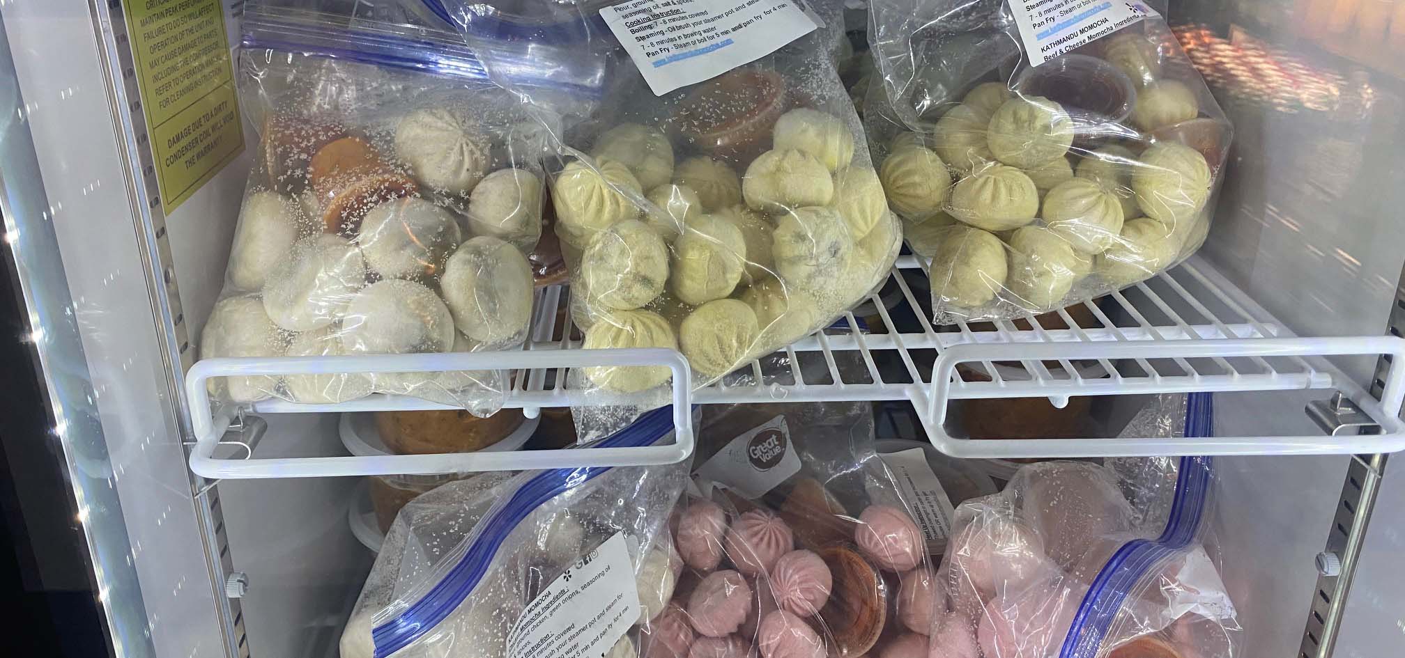 Freezer full of frozen Nepalese dumpling varieties.
