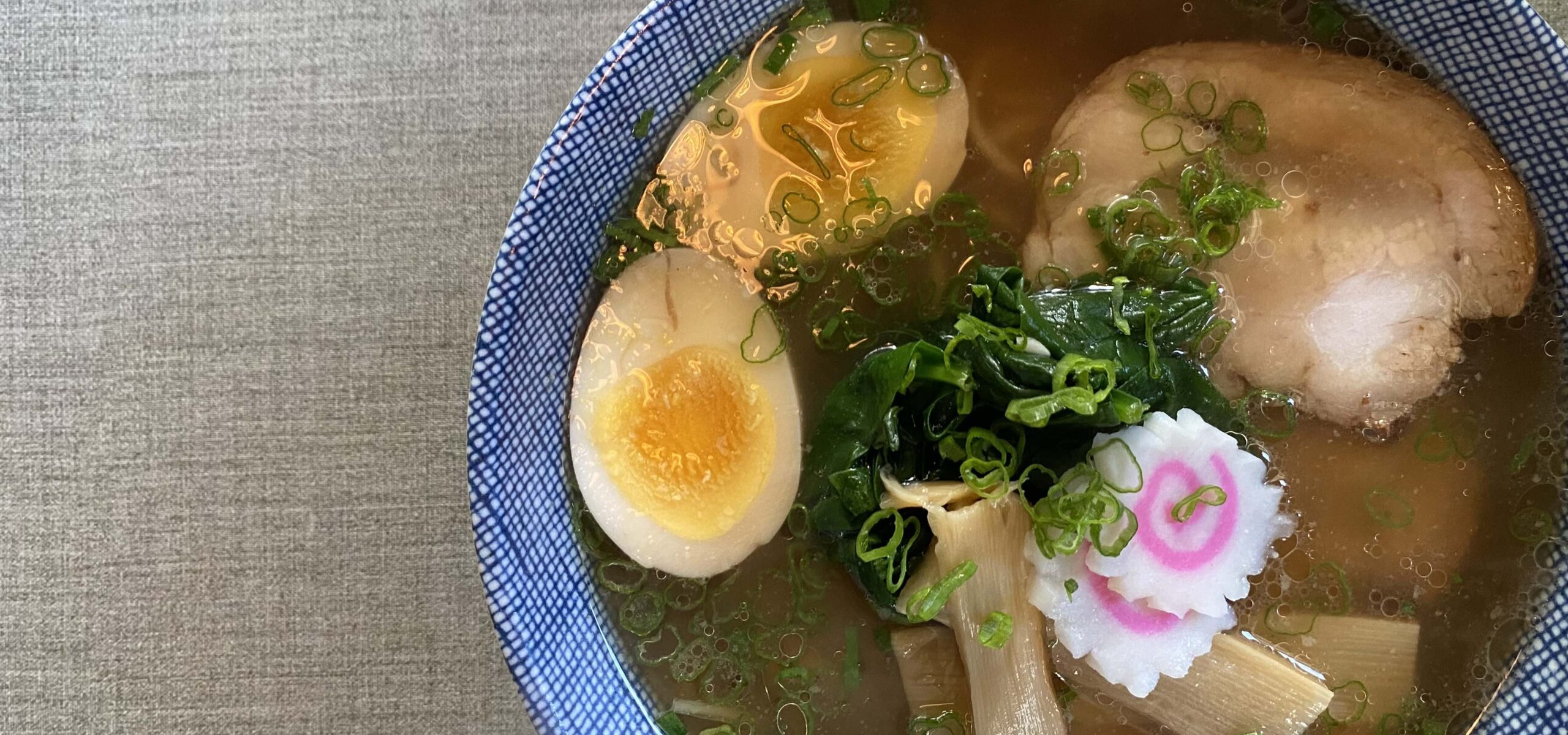 Bowl of ramen with soft egg and duck.