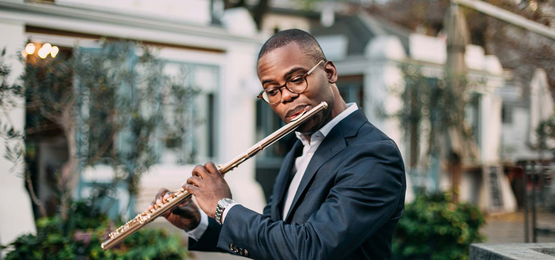 African-American man playing a flute