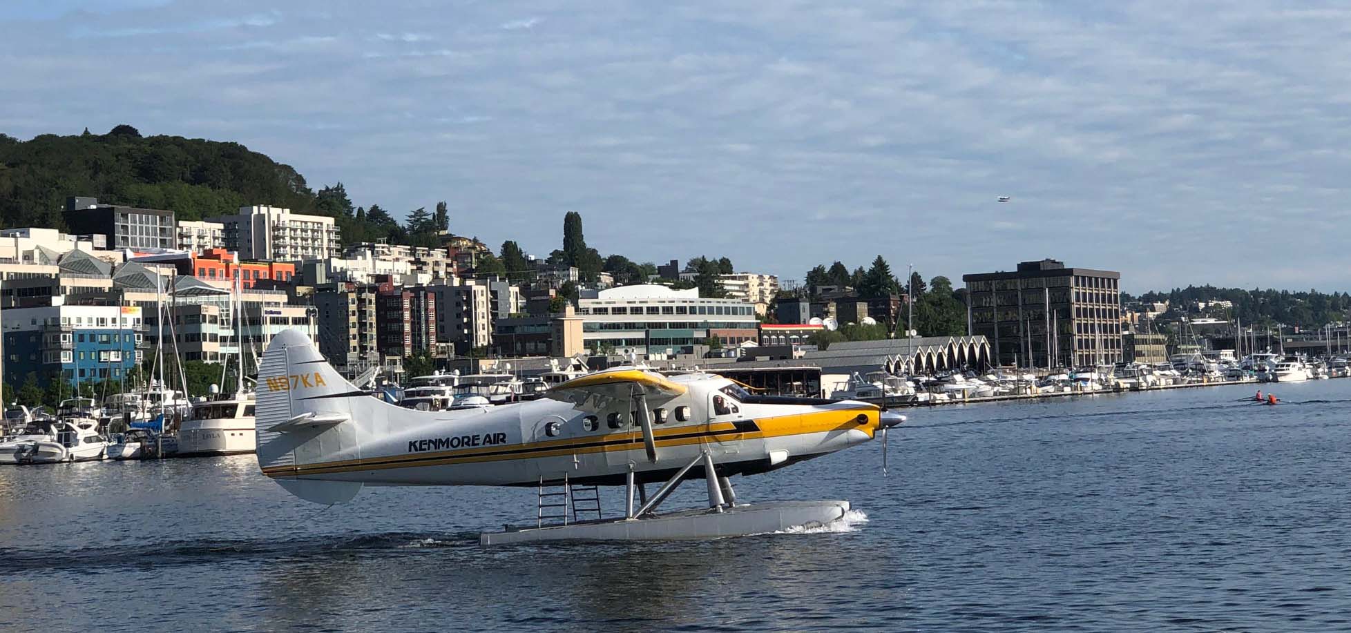 Floatplane cruising on a lake readying to take flight.