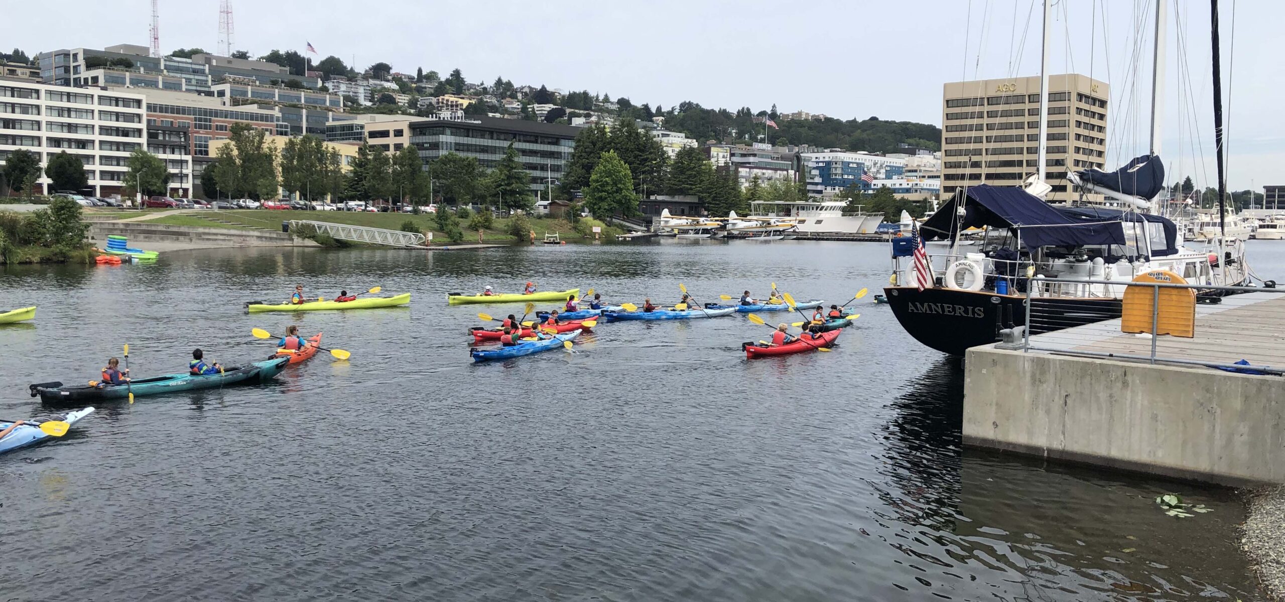 Group of people kayaking on Lake Union.