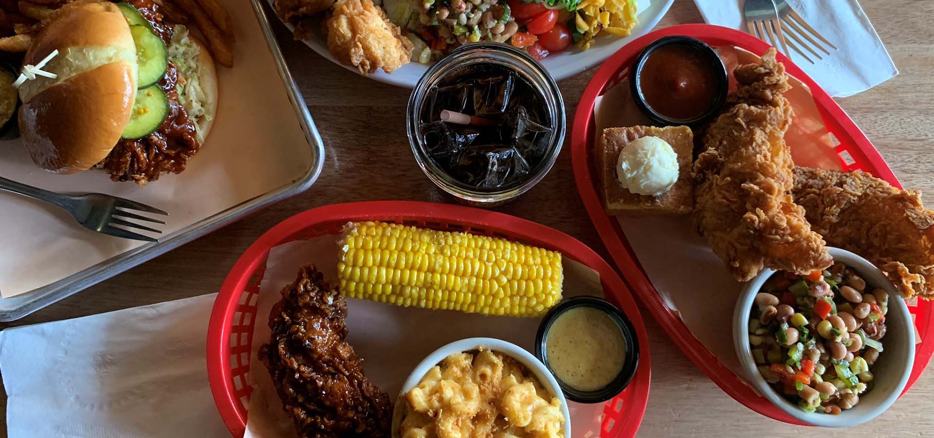 Bird's eye view of a fried chicken dinner with all the sides.