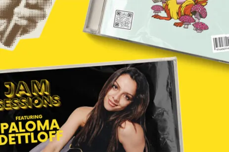 stack of CDs on yellow background