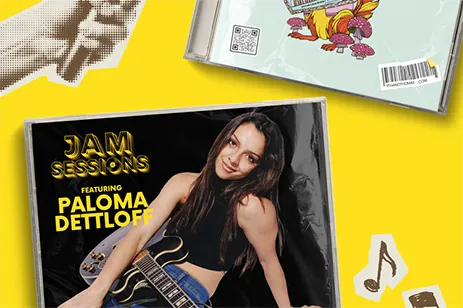 stack of CDs on yellow background