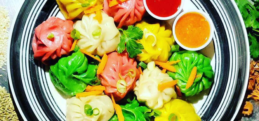 A plate of colorful dumplings.