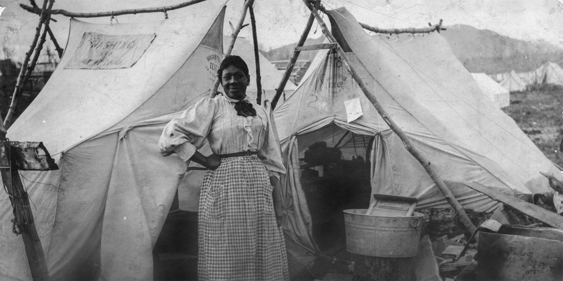 vintage image of woman in front of tent