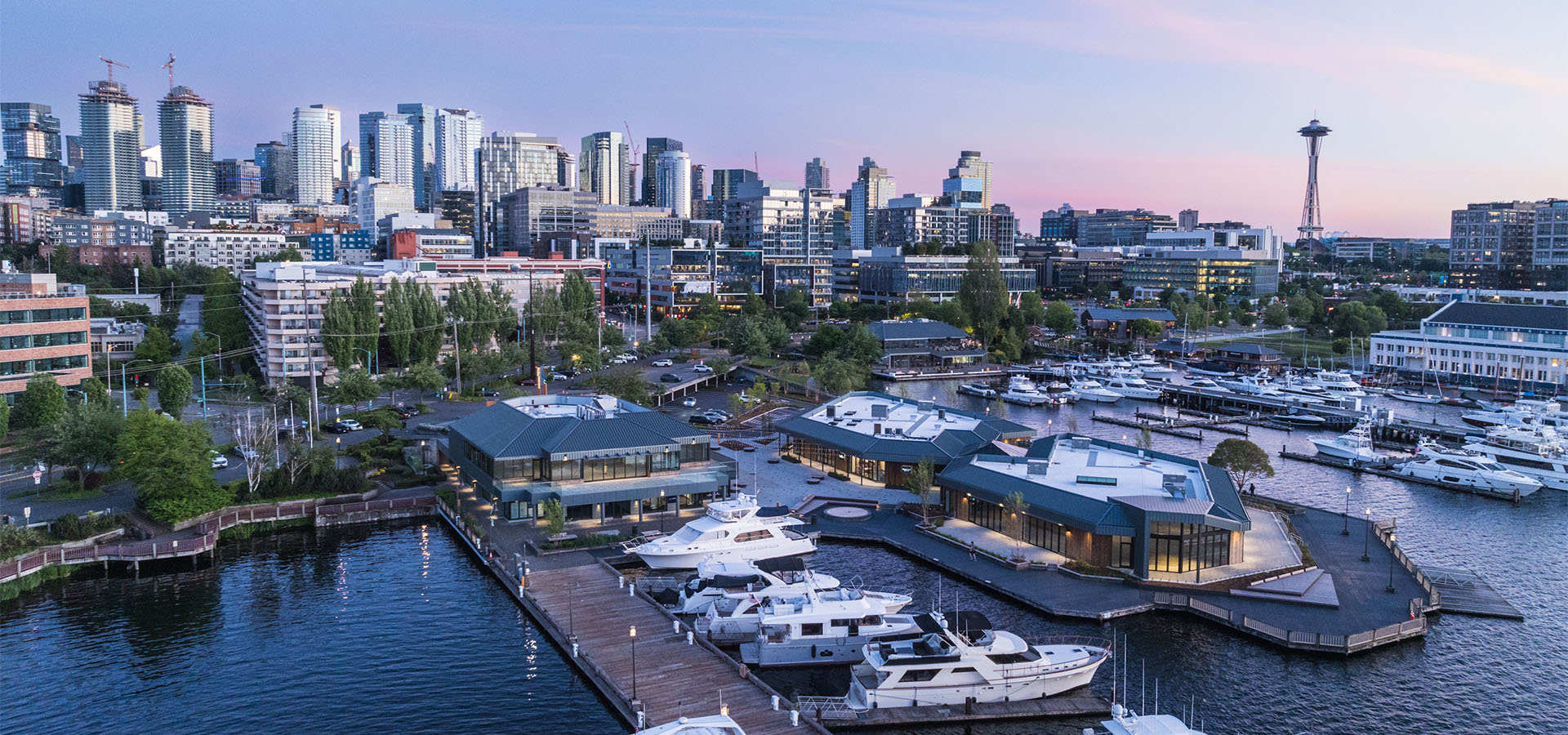 aerial view of lake union piers at dusk