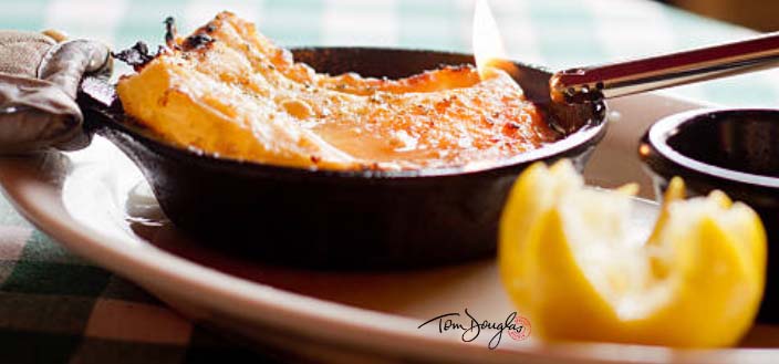 Baked cheese in a cast iron skillet.