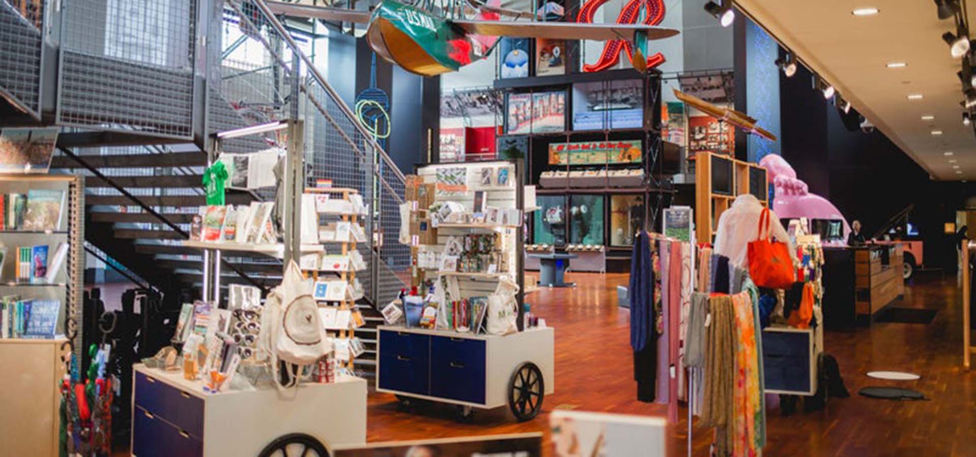 Interior view of the MOHAI Mercantile shop; view has kiosks filled with books, cards, and souvenirs.