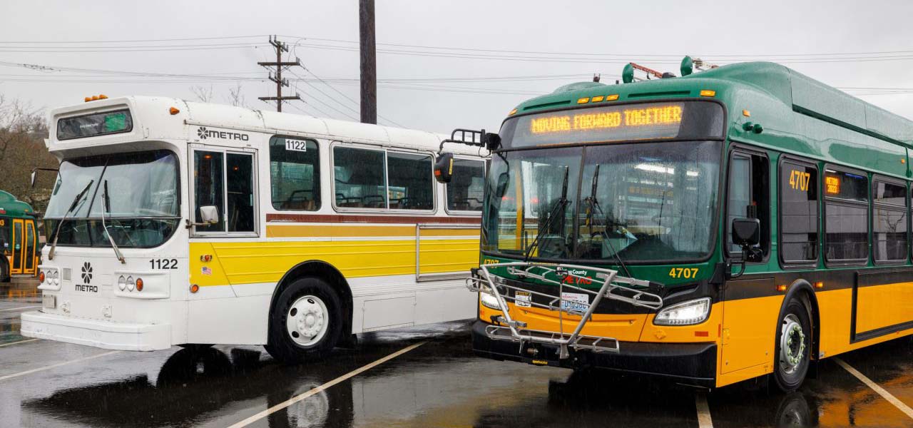 Two King County Metro buses parked by each other.