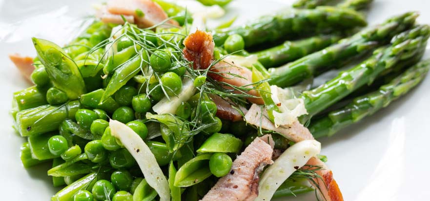 Plate of asparagus and peas.