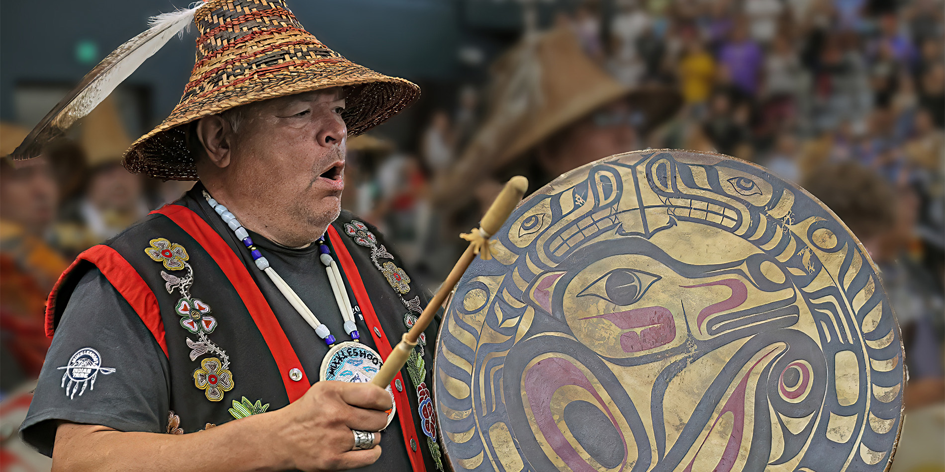 Native American man playing drum