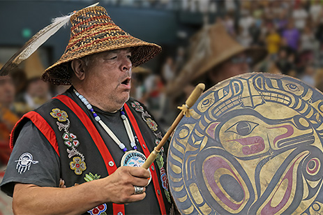 Native American man playing drum