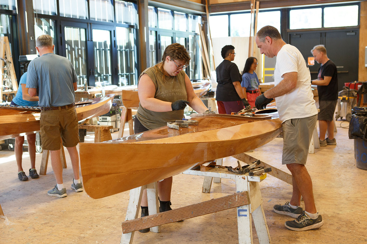 People building wooden boats