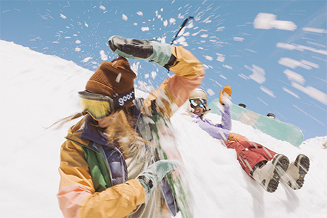 two women playing in snow