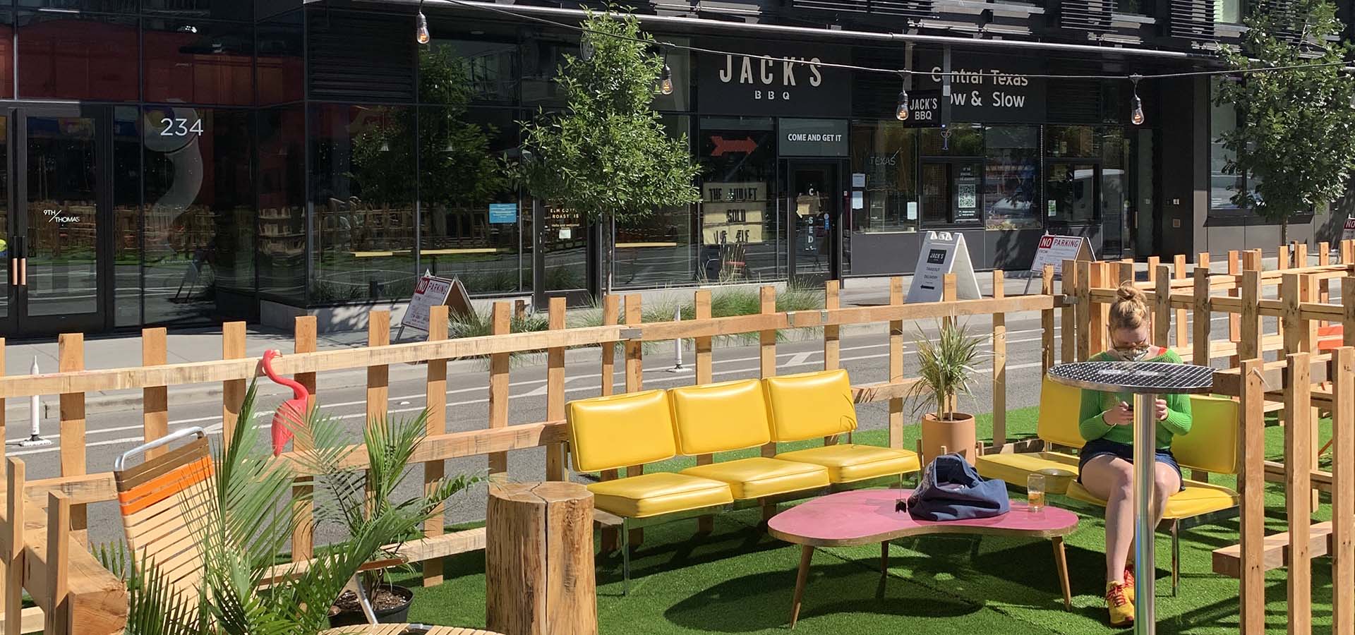 Outdoor street eatery set up with patio furniture