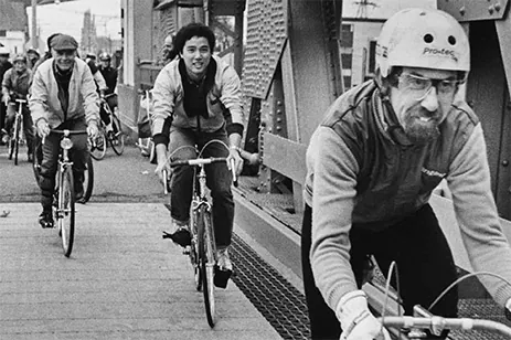 historical image of people riding bikes