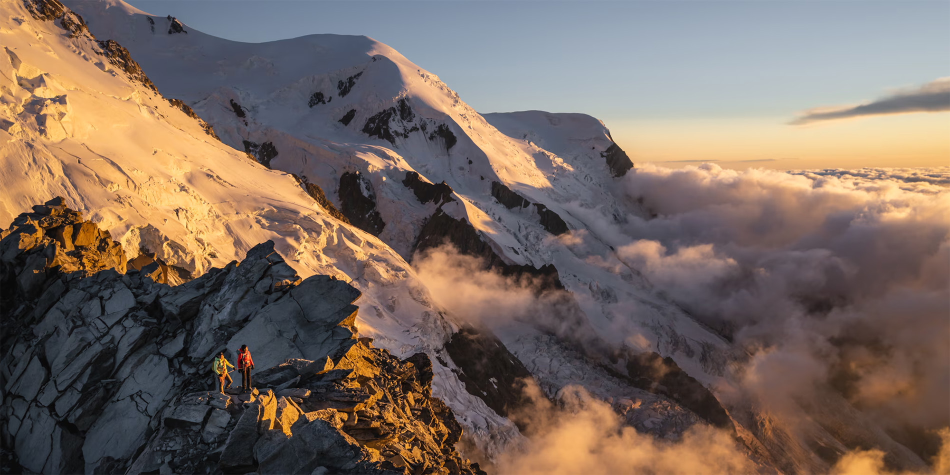 two people atop a mountain