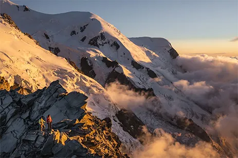 two people atop a mountain