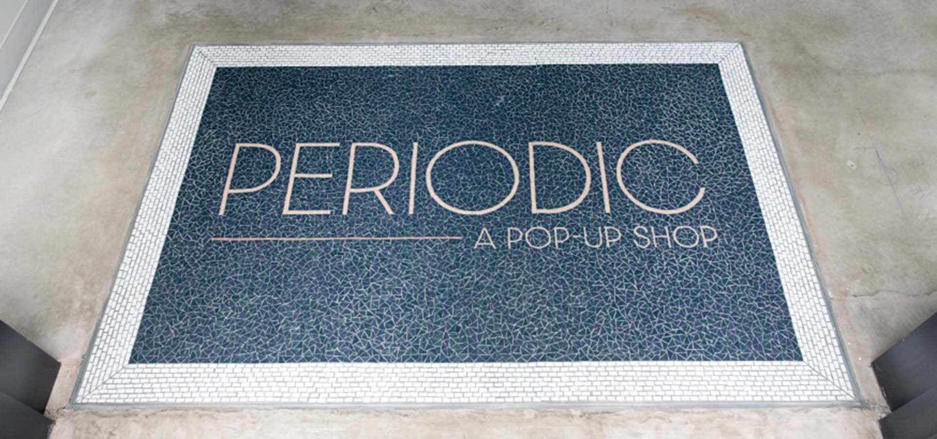 Doormat with store logo on it
