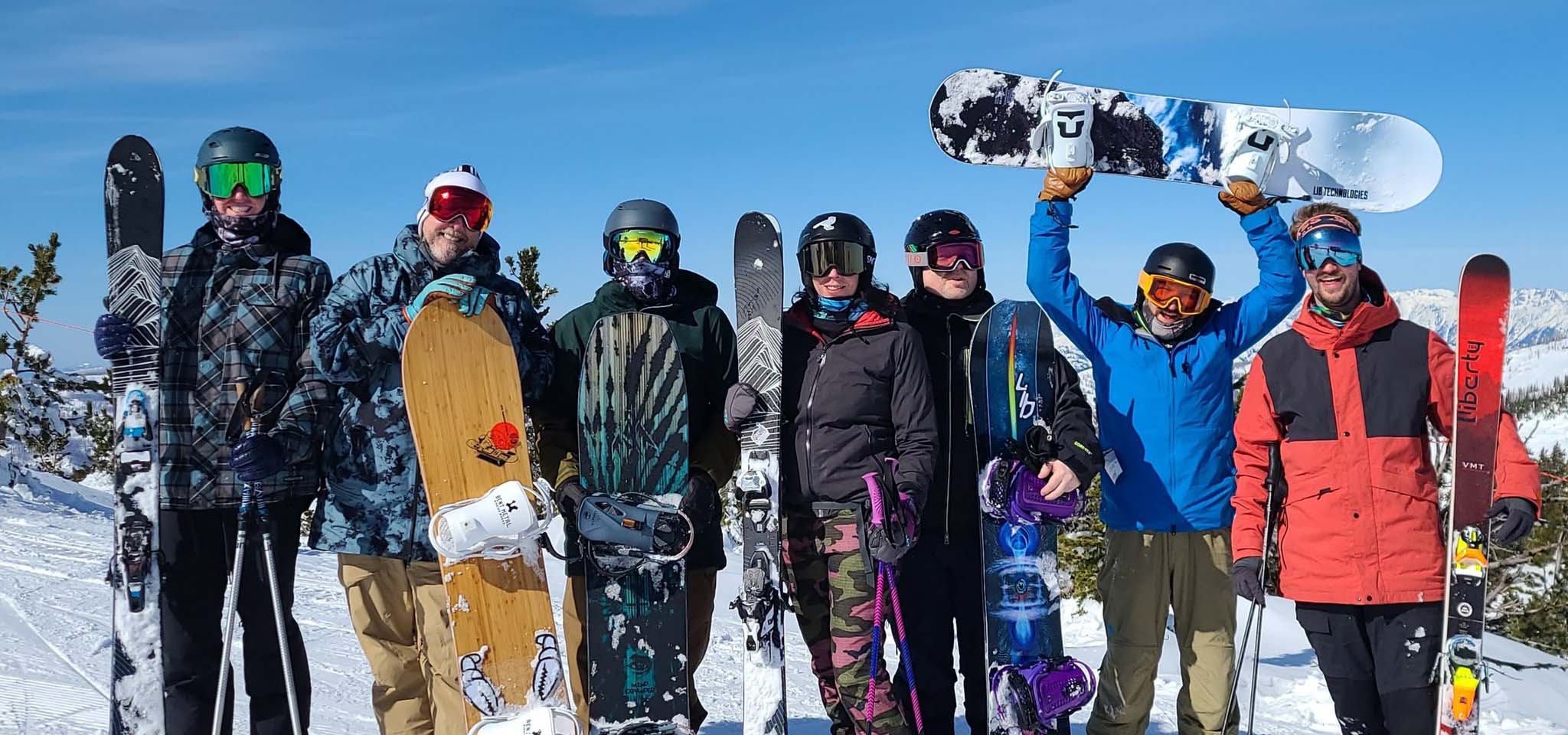 A group of skiers and snowboarders.