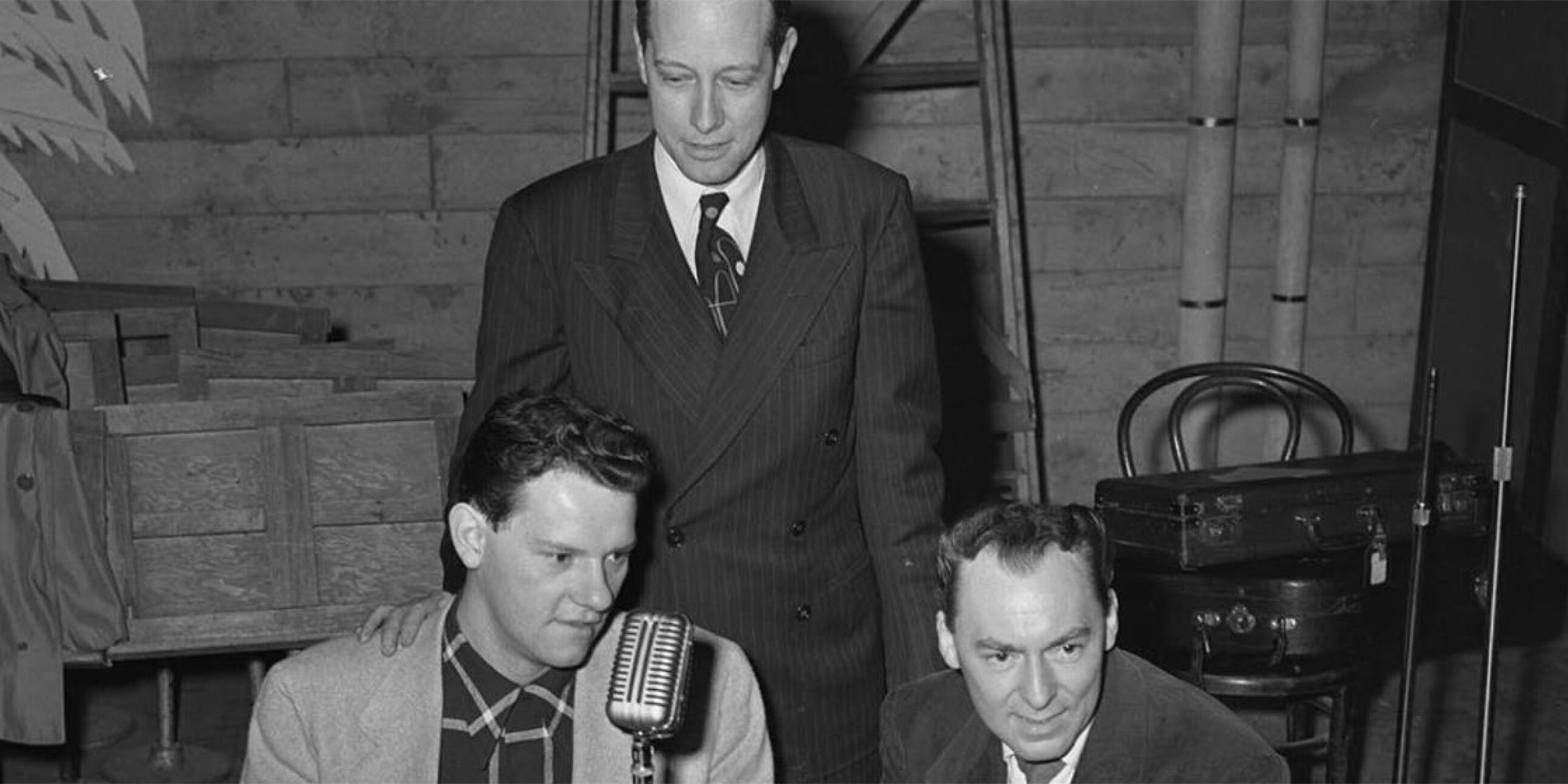 historical image of three men doing a podcast