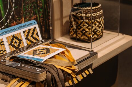 Native American basket weaving interactive experience in a museum setting.