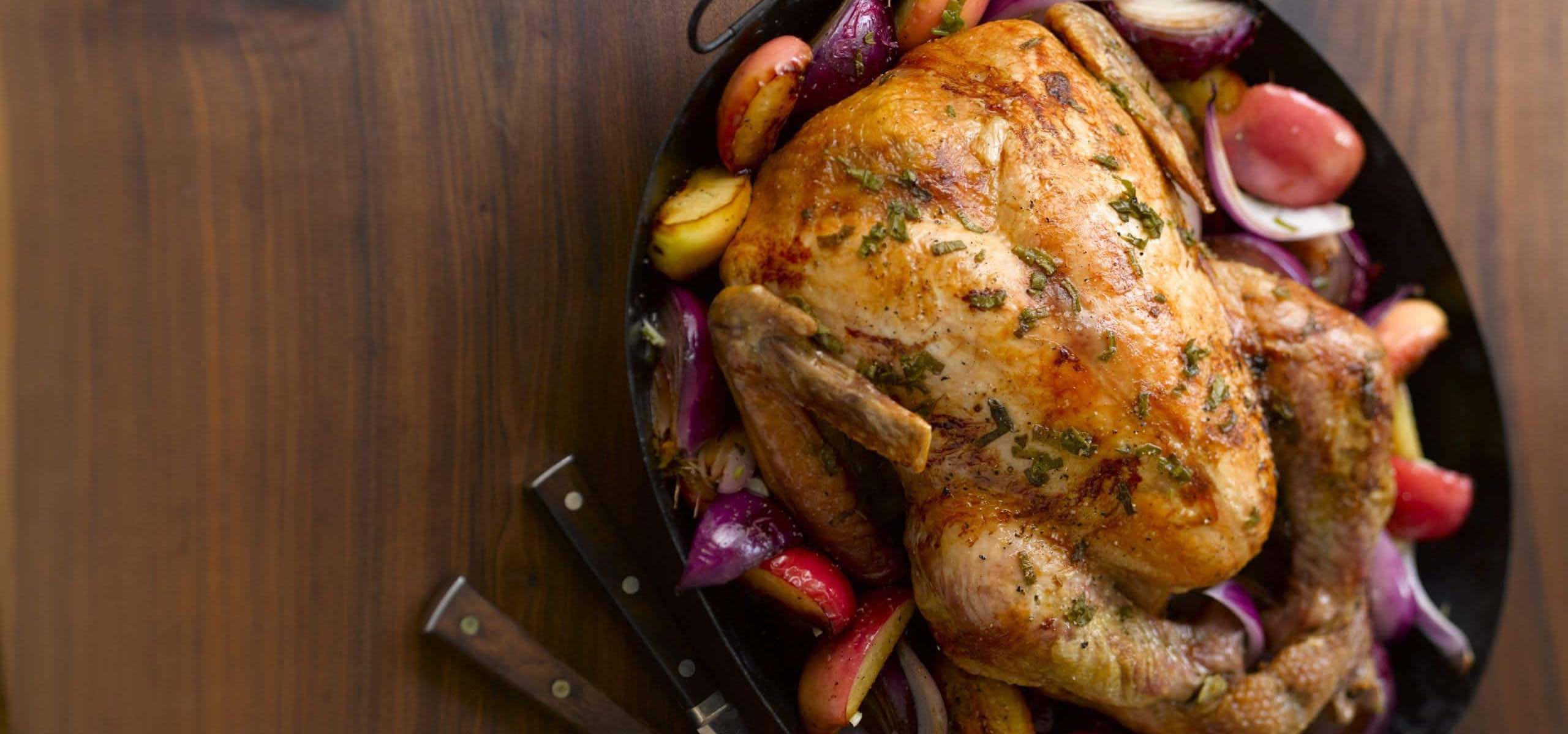 A Thanksgiving turkey on a wooden tray.
