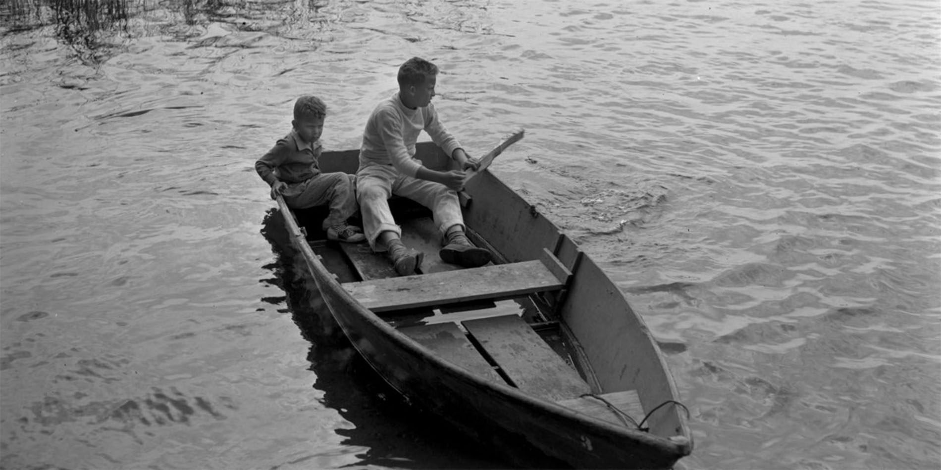 two boys in rowboat