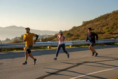 three people running
