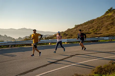 three people running