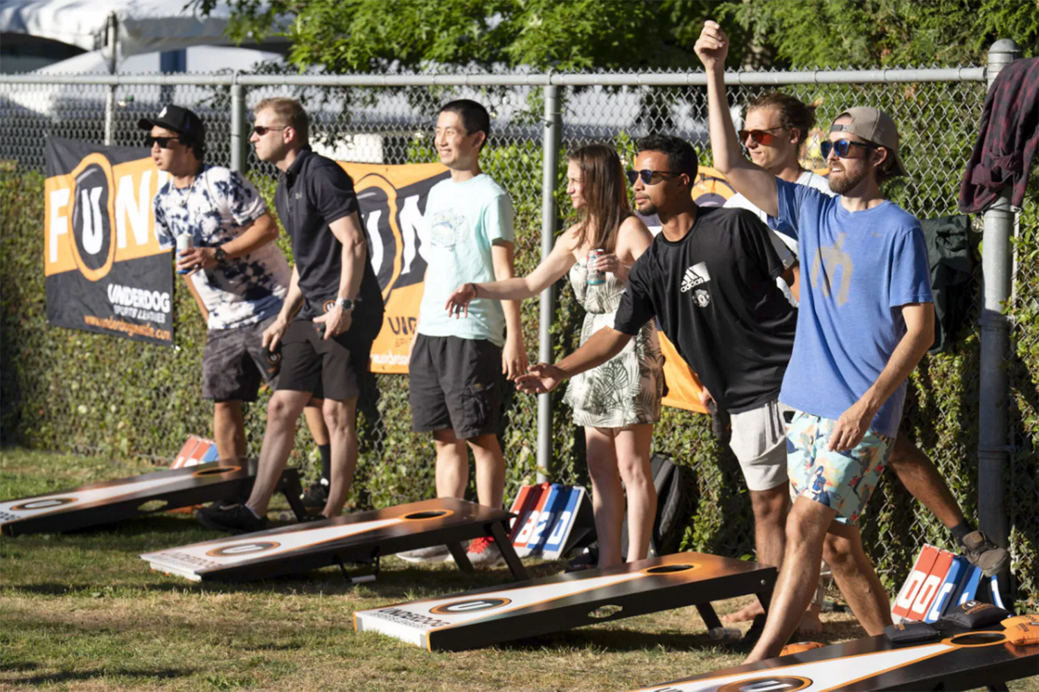 people playing cornhole