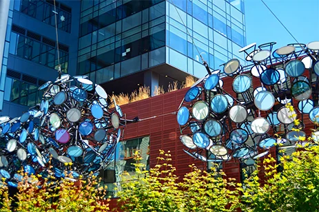 glass artwork in front of building