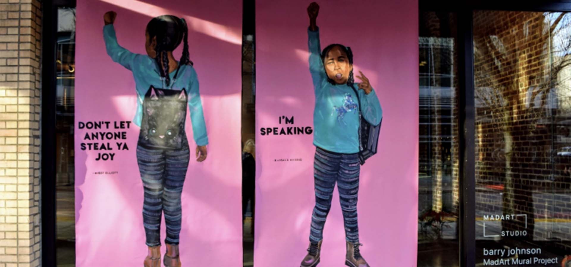 Window mural art featuring an African-American girl with messaging about BIPOC awareness.
