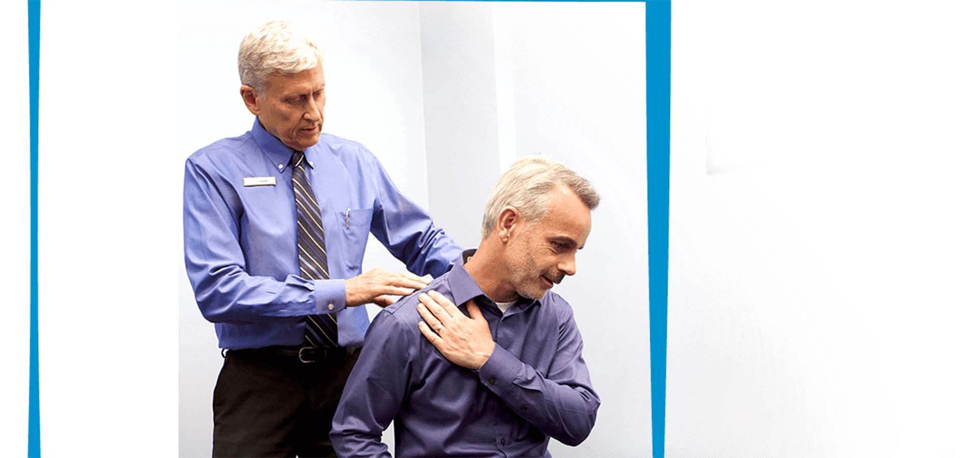 A chiropractic doctor adjusting a man's back