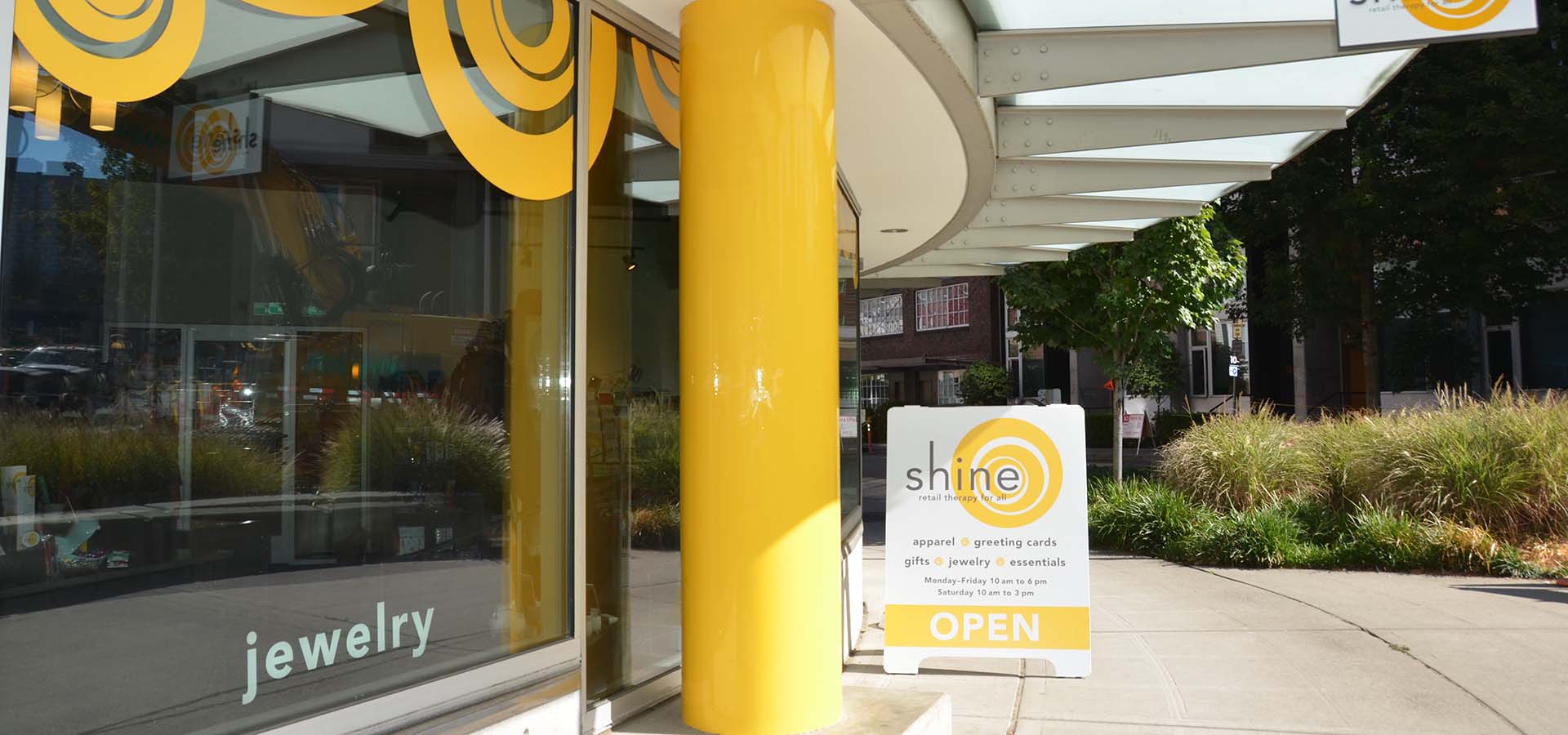 Outside storefront of a specialty clothing store, selling hats, dresses, jewelry for cancer patients.