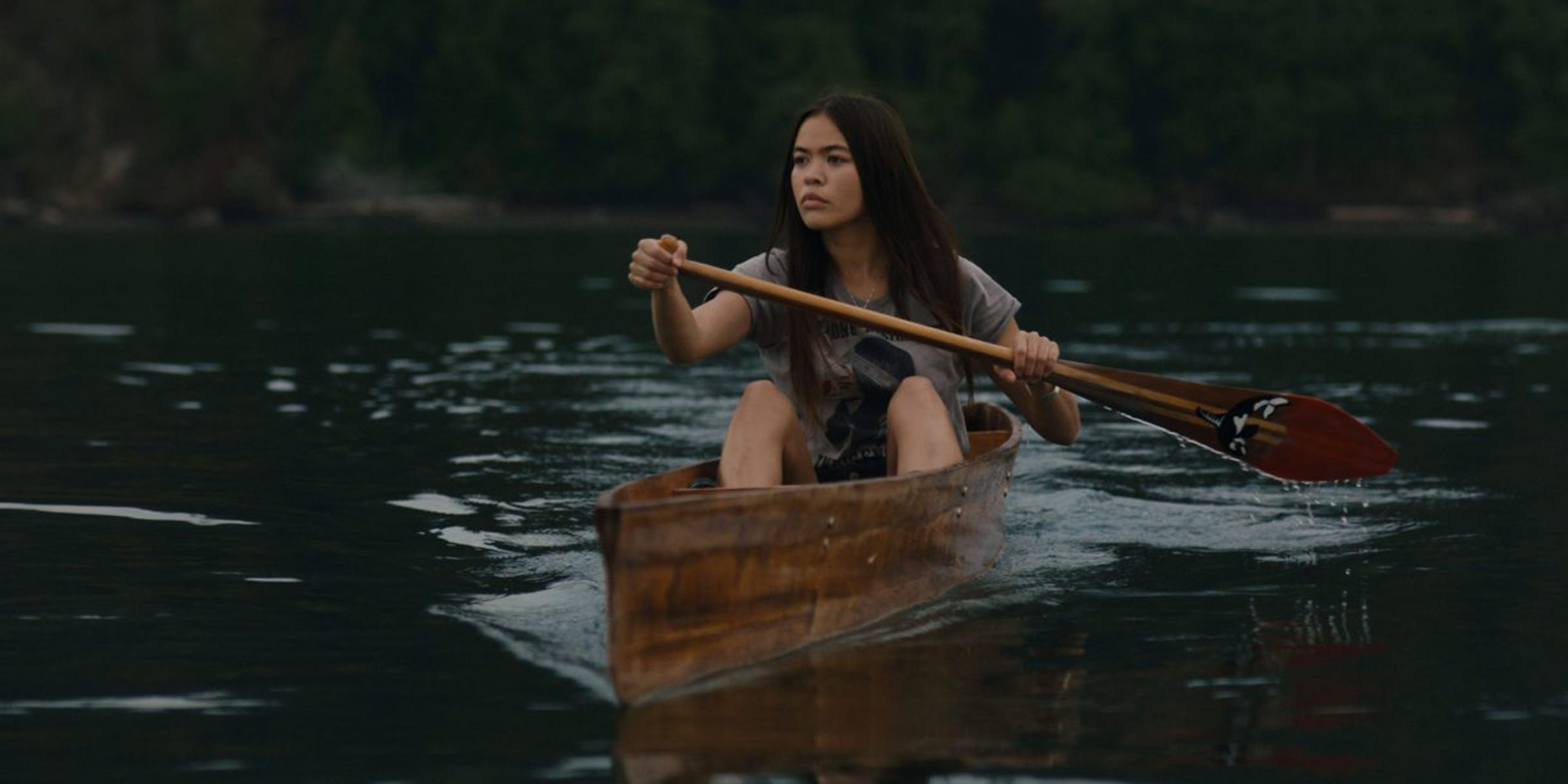woman paddling canoe