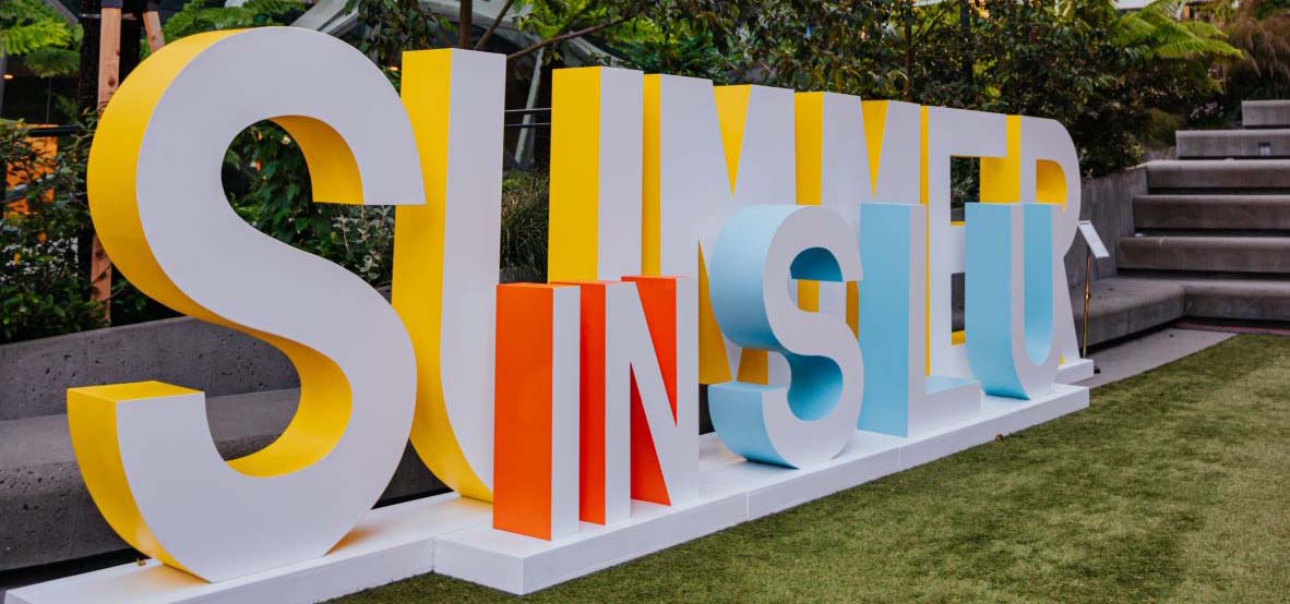 Giant display letters outside reading Summer In SLU.