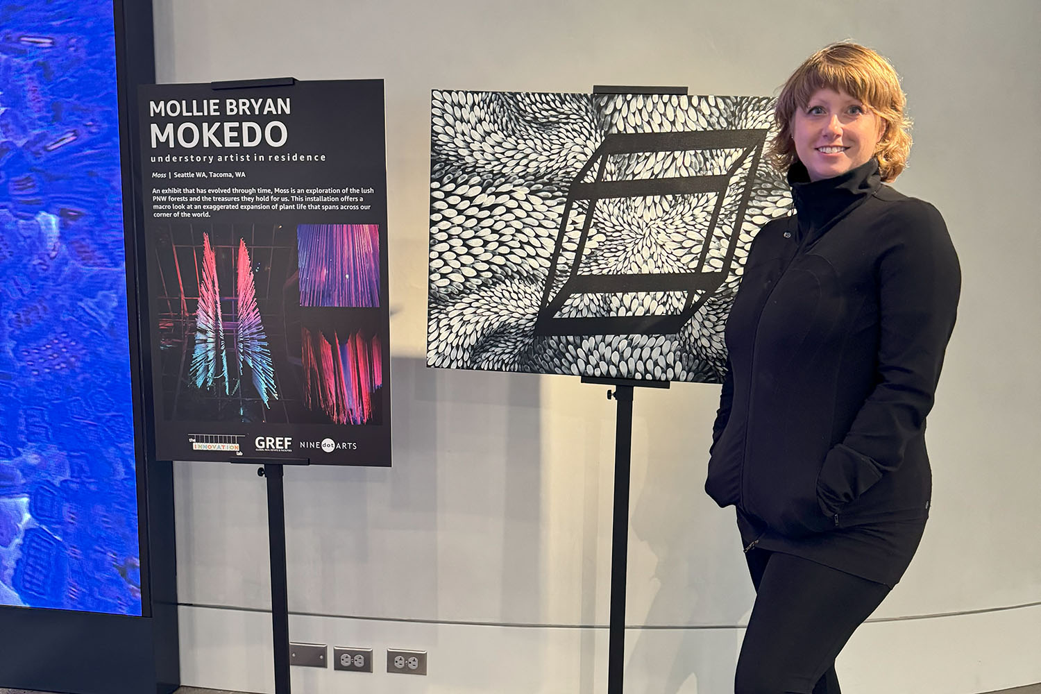 person standing in front of Mokedo sign