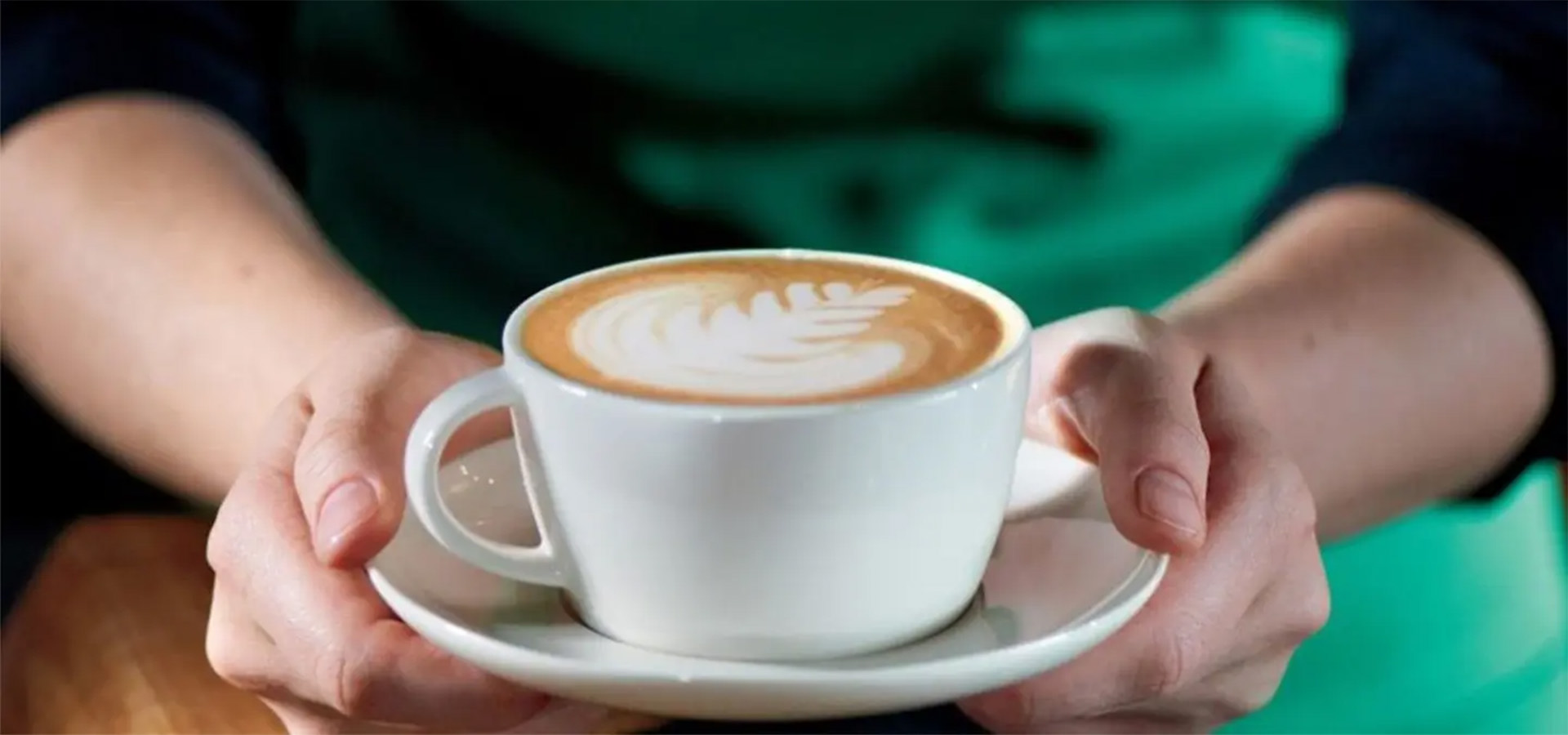 person holding cup of coffee