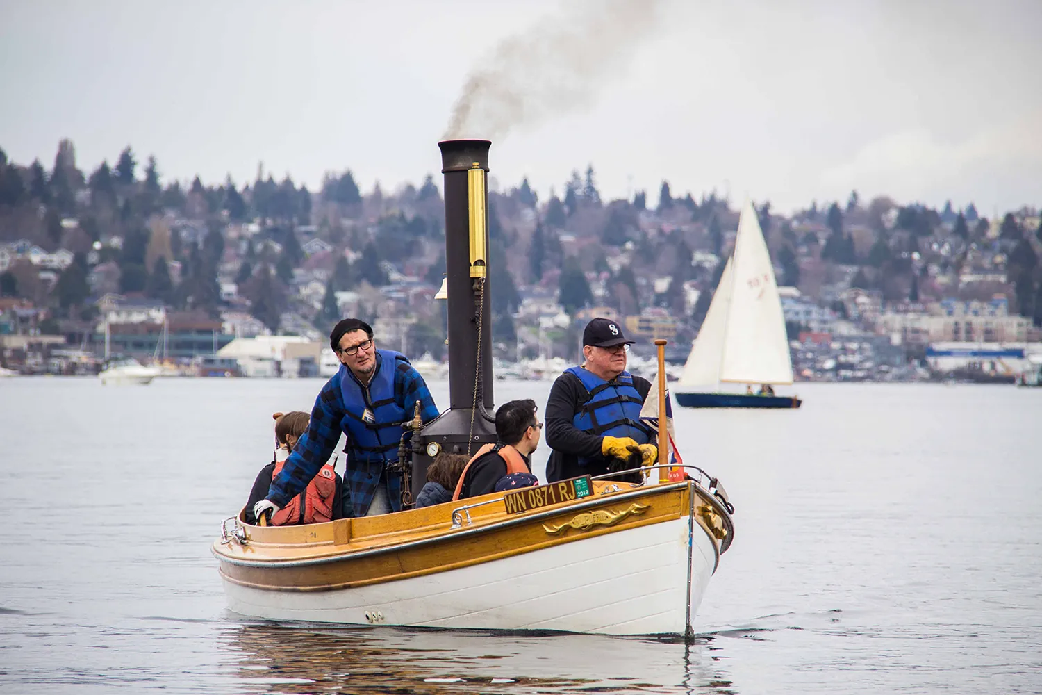 people in wooden boat
