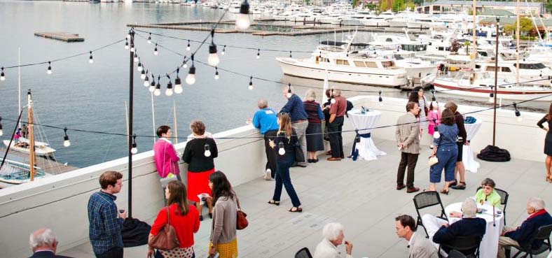 People at a party on an outdoor terrace.