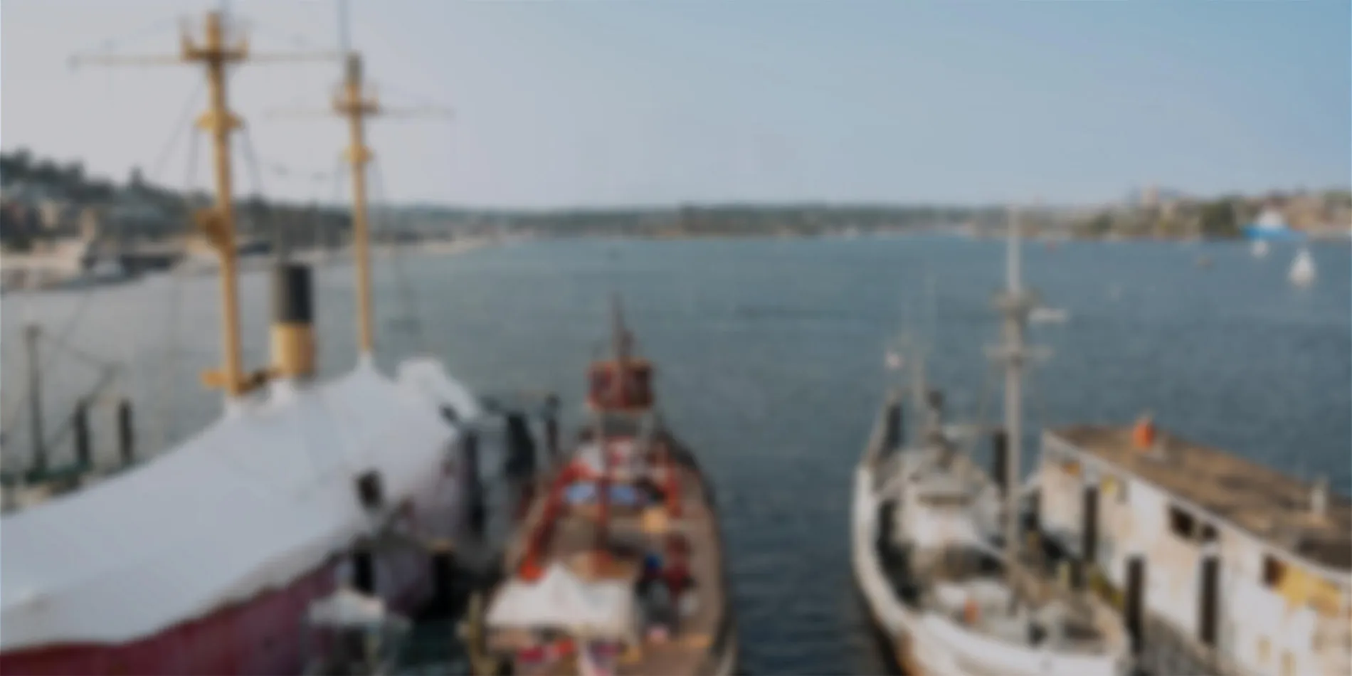 out of focus image of boats on water
