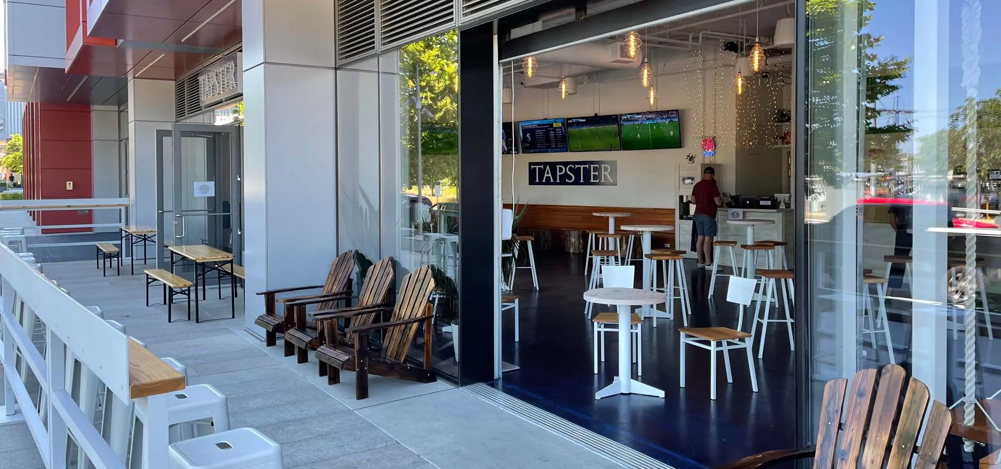 Open air self-serve taproom retail entry with patio.