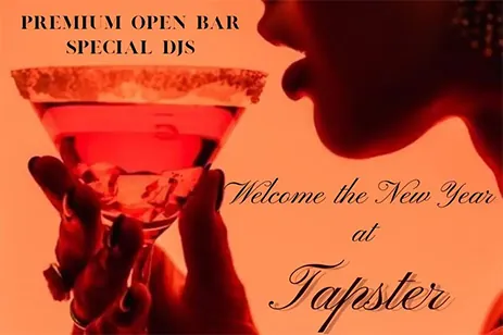 woman sipping cocktail