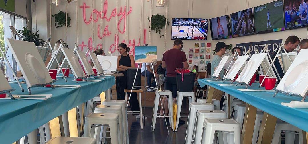 People setting up a painting party.
