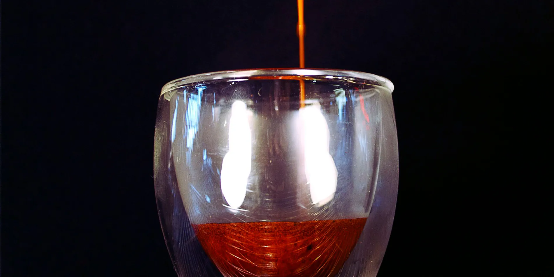 espresso shot pouring into glass