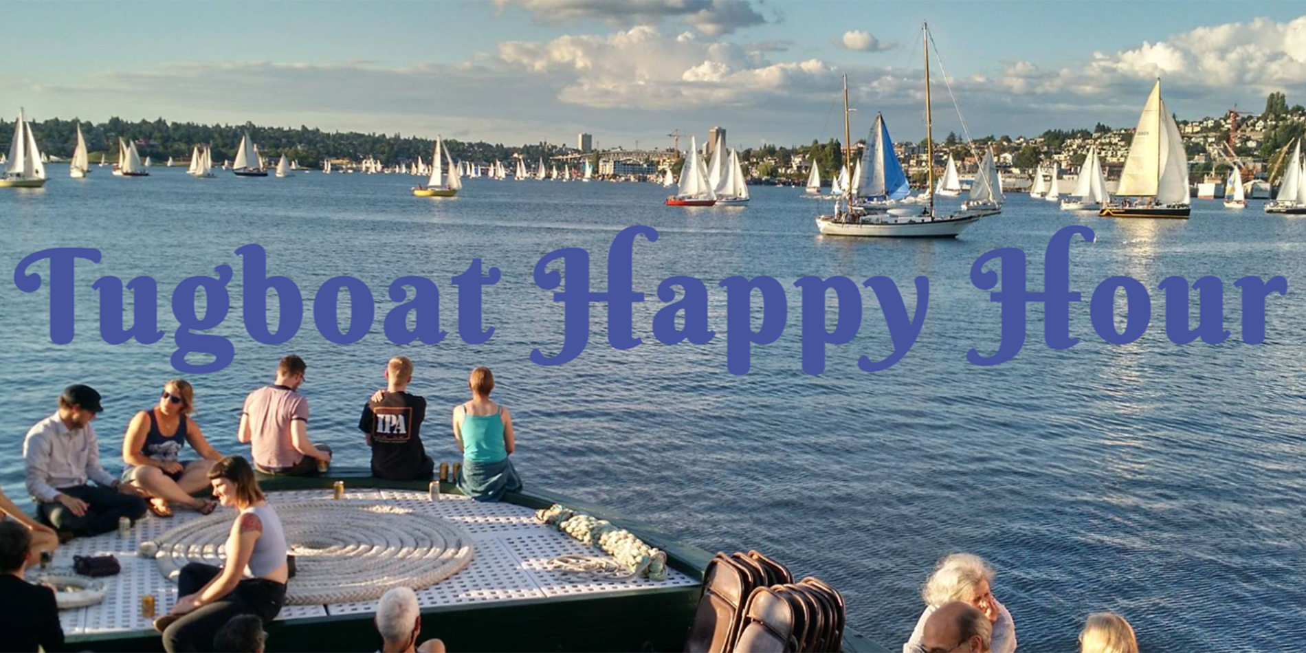 view of lake union with boats and people in the foreground