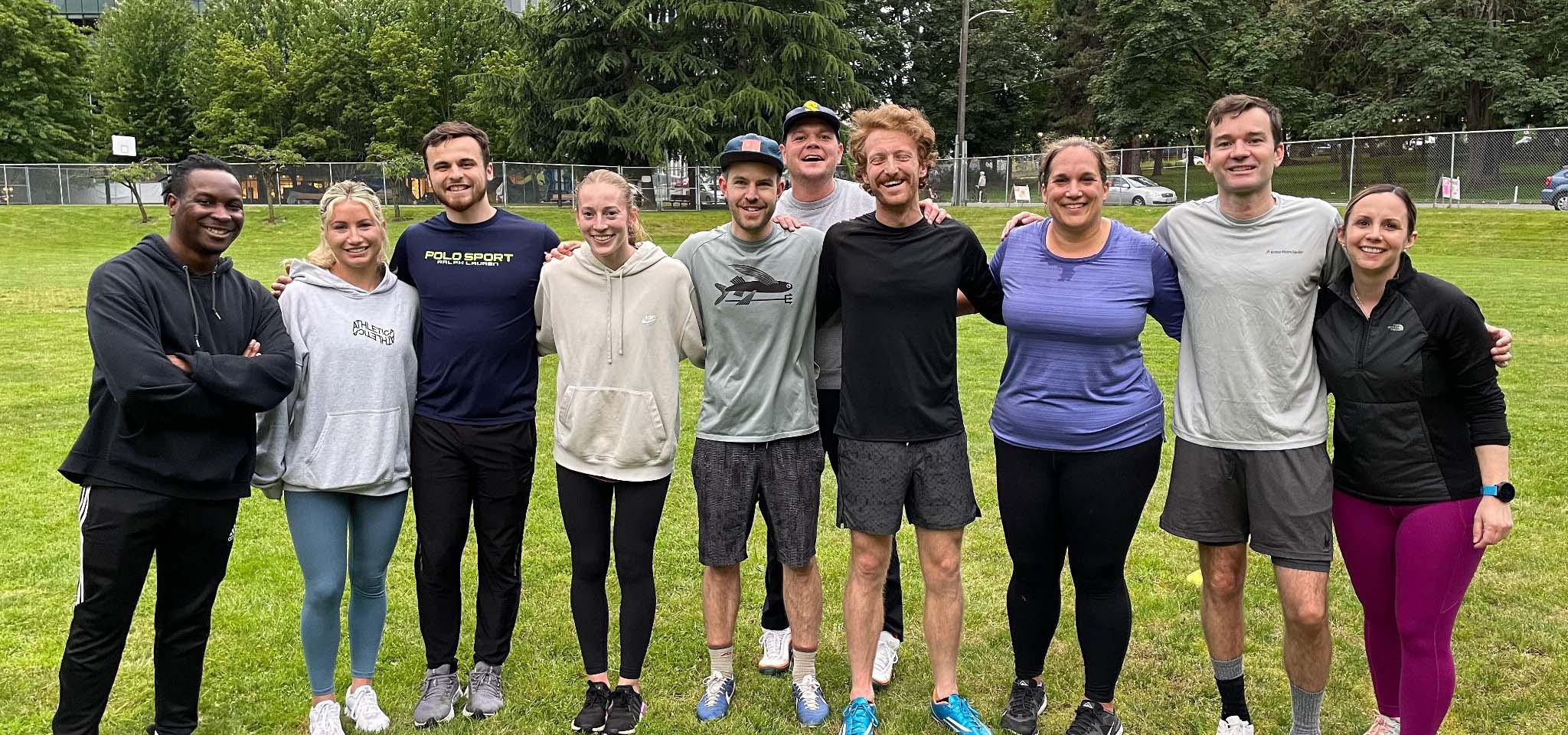 Group of rec league kickball players posing for a group photo.