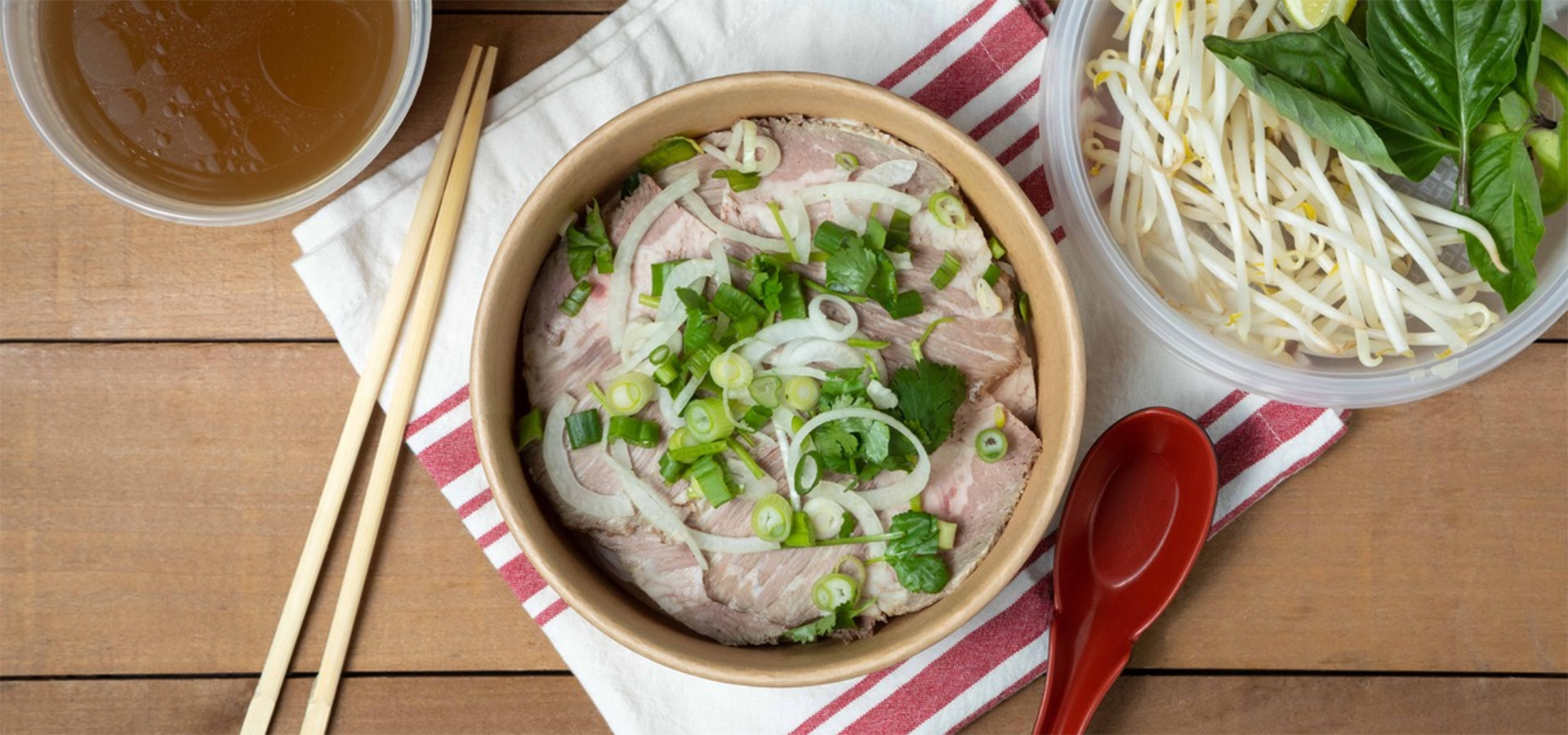 bowl of pho with sides